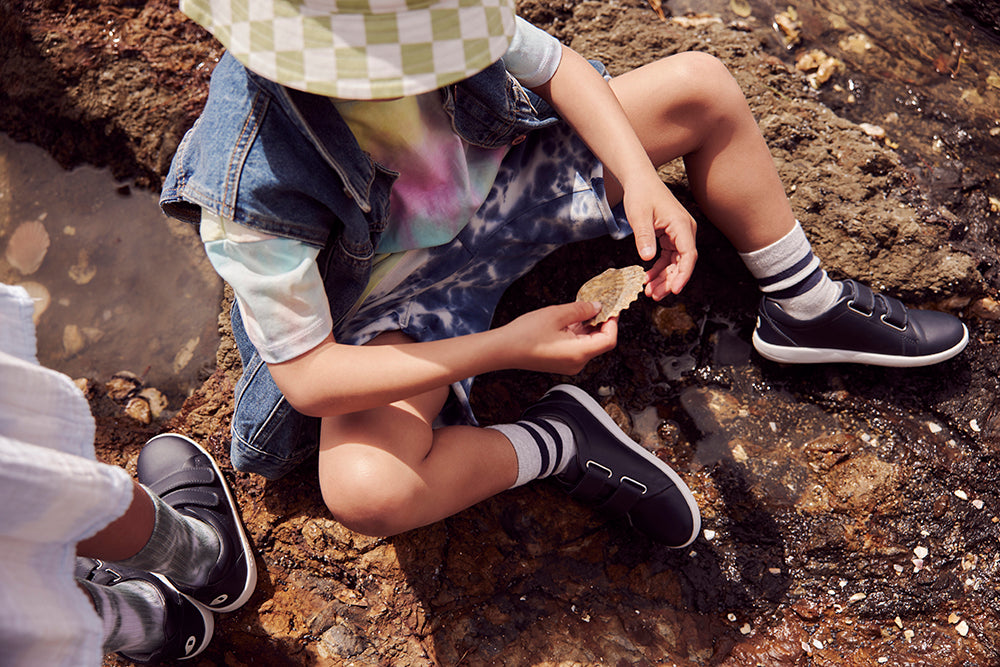 Bloom - image of children at rockpool wearing Bobux Grass Court shoes