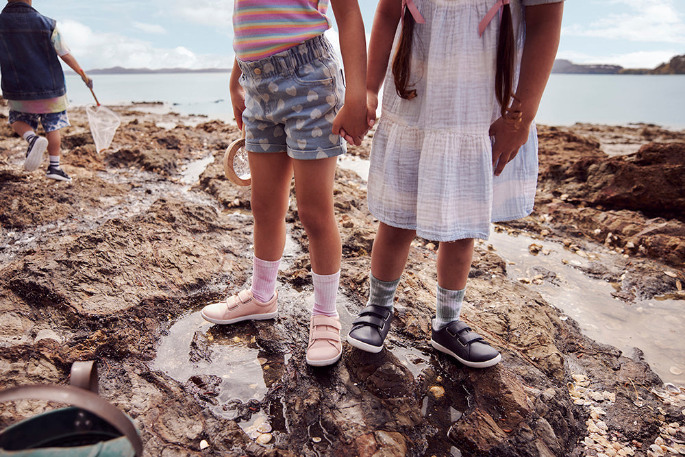 Bloom - image of children at rockpool wearing Bobux Grass Court shoes
