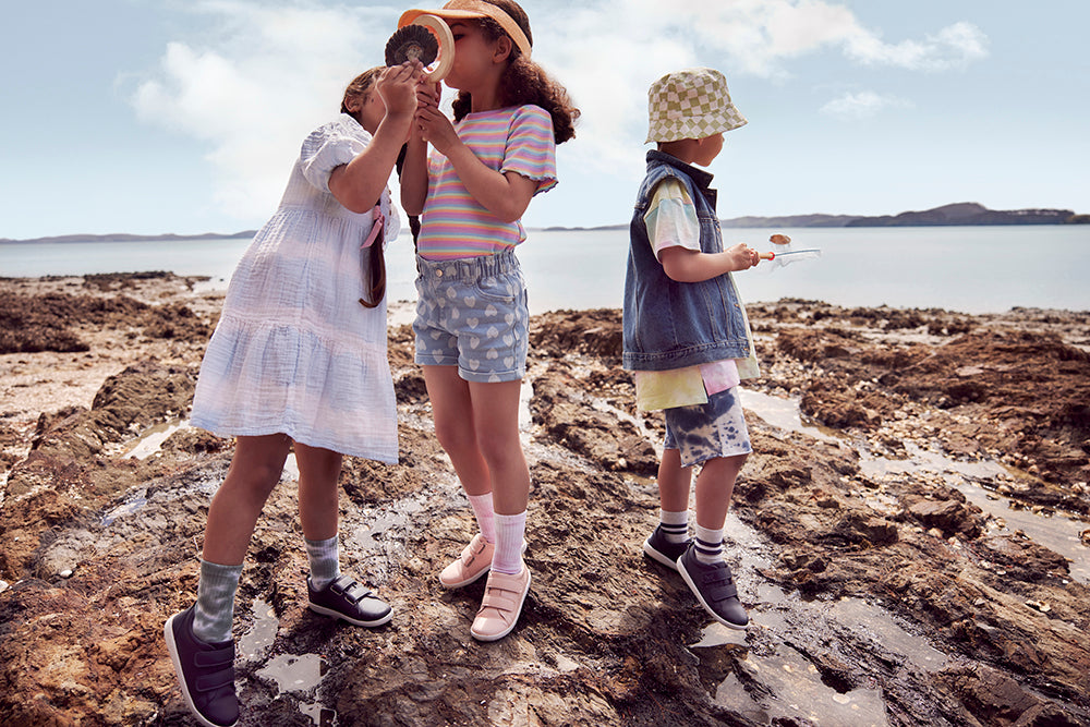 Bloom - image of children at rockpool wearing Bobux Grass Court shoes